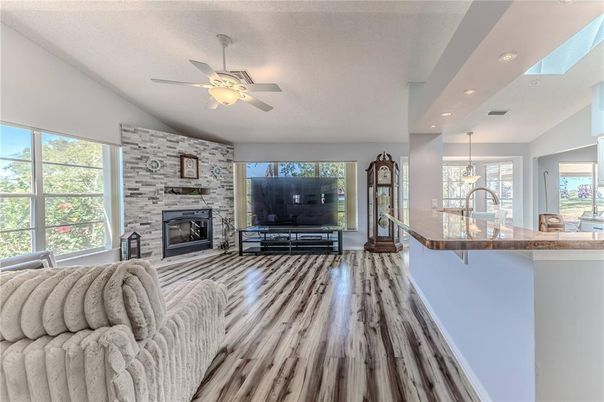 Fireplace, Interior, Kitchen, Living room, Pendant Lights, Recessed Lighting, Stone Walls, Wood Texture Flooring