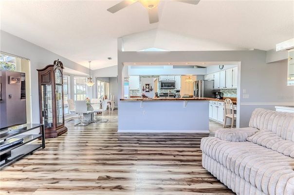 Dining room, Interior, Kitchen, Pendant Lights, Recessed Lighting, Stainless Steel Appliances, Wood Texture Flooring