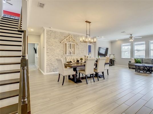 Chandelier, Dining room, Interior, Living room, Pendant Lights, Recessed Lighting, Stone Walls, Wood Texture Flooring