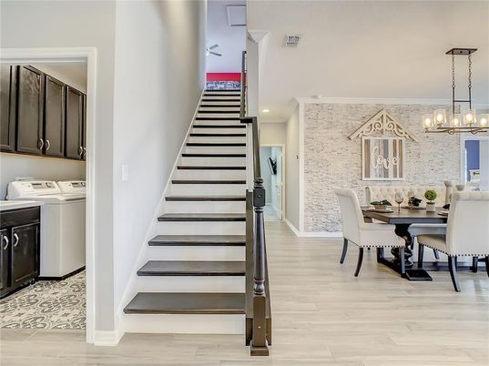Chandelier, Dining room, Interior, Pendant Lights, Recessed Lighting, Stone Walls, Wood Texture Flooring