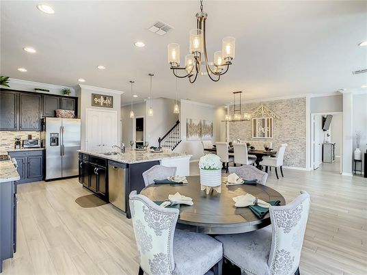 Chandelier, Dining room, Interior, Kitchen, Pendant Lights, Recessed Lighting, Stainless Steel Appliances, Wood Texture Flooring