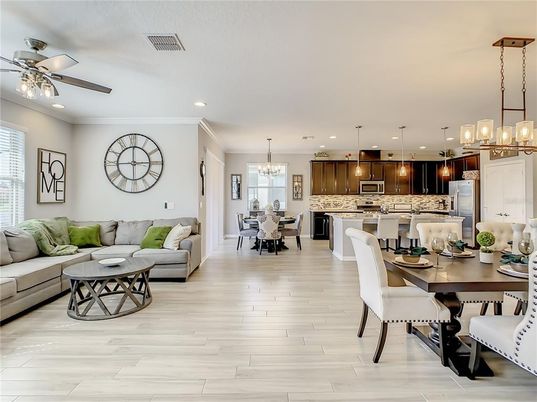 Chandelier, Dining room, Interior, Kitchen, Living room, Pendant Lights, Recessed Lighting, Stainless Steel Appliances, Wood Texture Flooring