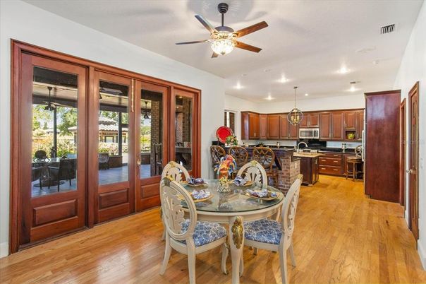 Dining room, Interior, Kitchen, Recessed Lighting, Stainless Steel Appliances, Wood Texture Flooring