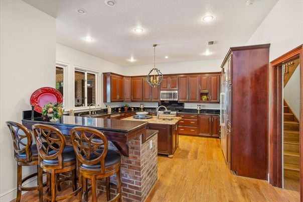 Interior, Kitchen, Pendant Lights, Recessed Lighting, Stainless Steel Appliances, Wood Texture Flooring