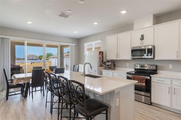 Dining room, Interior, Kitchen, Recessed Lighting, Stainless Steel Appliances, Wood Texture Flooring