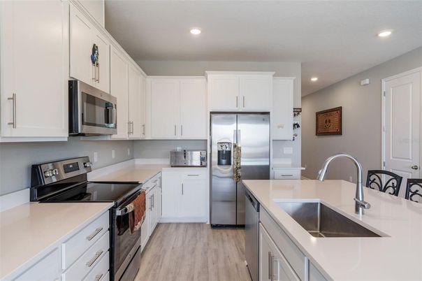 Interior, Kitchen, Recessed Lighting, Stainless Steel Appliances, Wood Texture Flooring