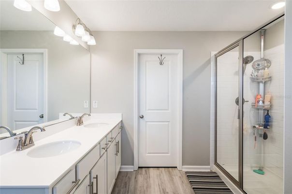 Bathroom, Dual Sink Vanities, Glass Shower, Interior, Wood Texture Flooring