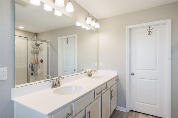 Bathroom, Dual Sink Vanities, Interior, Recessed Lighting, Wood Texture Flooring