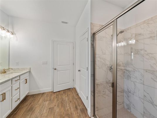 Bathroom, Glass Shower, Interior, Marble Walls, Wood Texture Flooring
