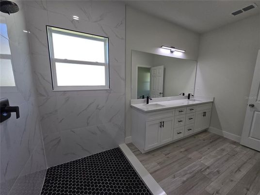 Bathroom, Dual Sink Vanities, Interior, Marble Walls, Wood Texture Flooring