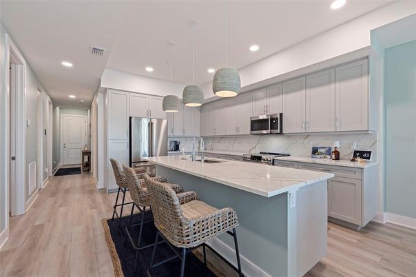 Interior, Kitchen, Pendant Lights, Recessed Lighting, Stainless Steel Appliances, Wood Texture Flooring