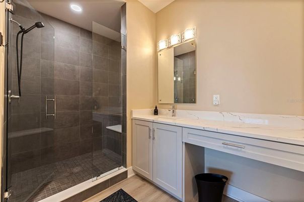 Bathroom, Dual Sink Vanities, Glass Shower, Interior, Recessed Lighting, Wood Texture Flooring
