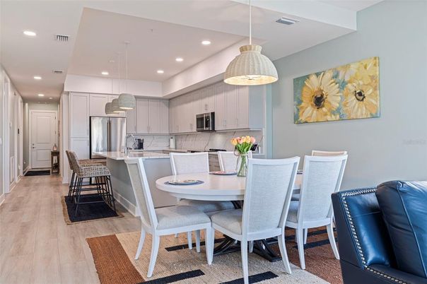 Dining room, Interior, Kitchen, Pendant Lights, Recessed Lighting, Stainless Steel Appliances, Wood Texture Flooring