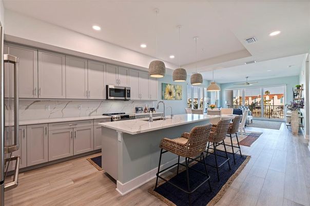 Interior, Kitchen, Marble Walls, Pendant Lights, Recessed Lighting, Stainless Steel Appliances, Wood Texture Flooring