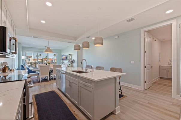 Dining room, Interior, Kitchen, Pendant Lights, Recessed Lighting, Stainless Steel Appliances, Wood Texture Flooring