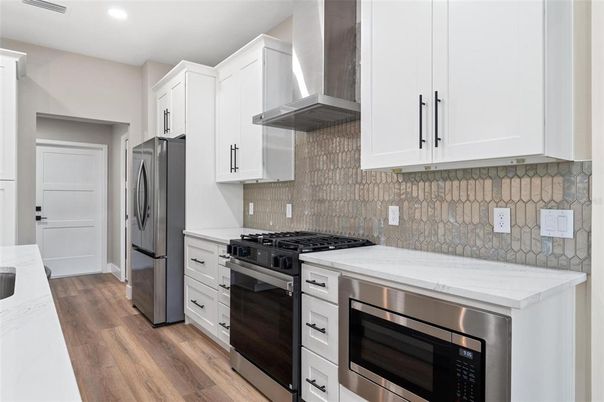 Interior, Kitchen, Recessed Lighting, Stainless Steel Appliances, Wood Texture Flooring