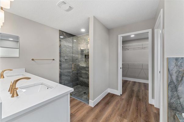 Bathroom, Glass Shower, Interior, Recessed Lighting, Walk-in Closets, Wood Texture Flooring