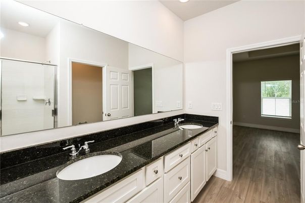 Bathroom, Dual Sink Vanities, Interior, Recessed Lighting, Wood Texture Flooring