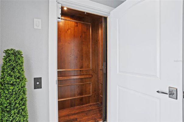 Elevator, Interior, Recessed Lighting, Wood Texture Flooring, Wooden Walls