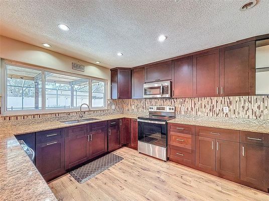 Interior, Kitchen, Recessed Lighting, Stainless Steel Appliances, Wood Texture Flooring