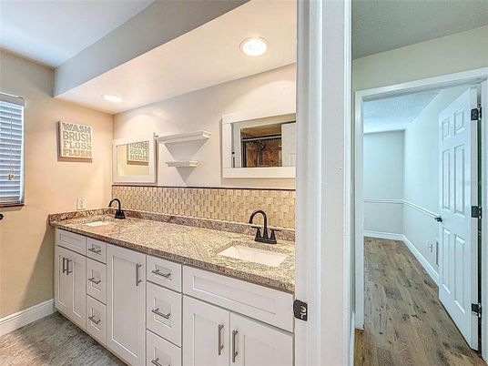 Bathroom, Dual Sink Vanities, Interior, Recessed Lighting, Wood Texture Flooring
