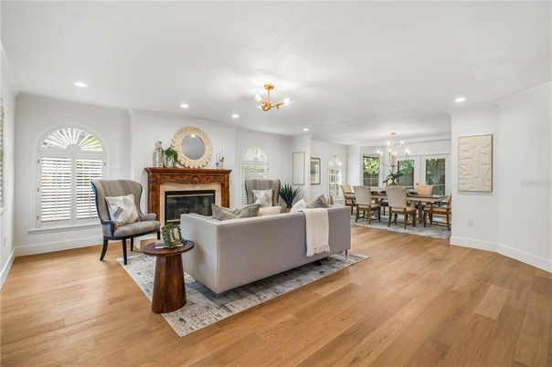 Chandelier, Dining room, Fireplace, Interior, Living room, Recessed Lighting, Wood Texture Flooring