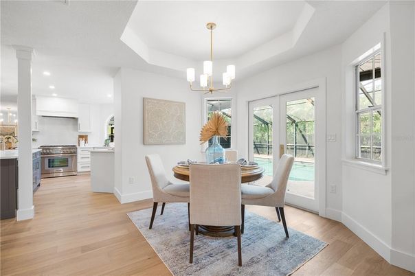 Dining room, Interior, Kitchen, Pendant Lights, Recessed Lighting, Stainless Steel Appliances, Wood Texture Flooring