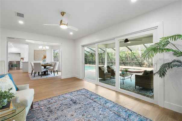 Chandelier, Dining room, Interior, Kitchen, Living room, Recessed Lighting, Stainless Steel Appliances, Wood Texture Flooring