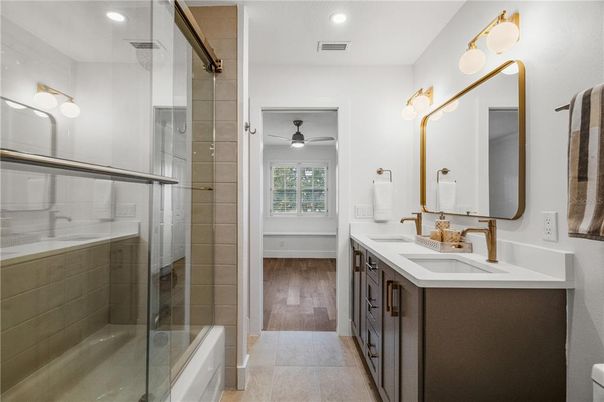 Bathroom, Dual Sink Vanities, Glass Shower, Interior, Recessed Lighting, Wood Texture Flooring