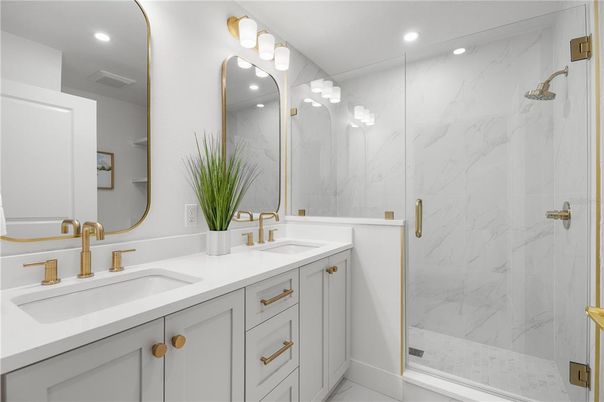 Bathroom, Dual Sink Vanities, Glass Shower, Interior, Marble Walls, Recessed Lighting