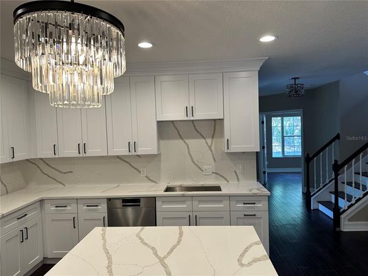 Interior, Kitchen, Marble Walls, Recessed Lighting, Stainless Steel Appliances, Wood Texture Flooring