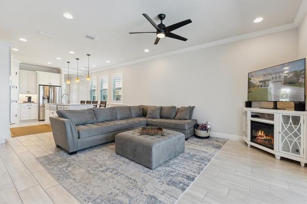 Fireplace, Interior, Kitchen, Living room, Pendant Lights, Recessed Lighting, Stainless Steel Appliances, Wood Texture Flooring