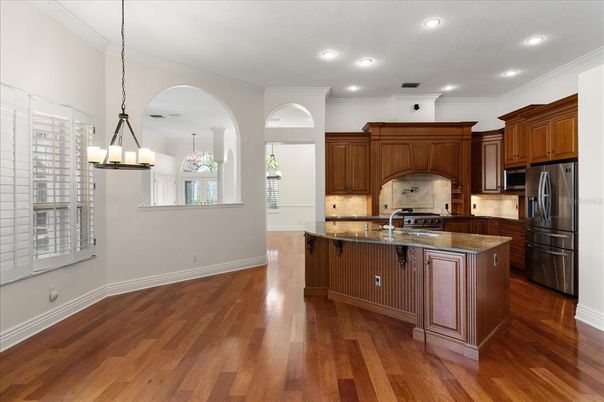 Chandelier, Interior, Kitchen, Pendant Lights, Recessed Lighting, Stainless Steel Appliances, Wood Texture Flooring