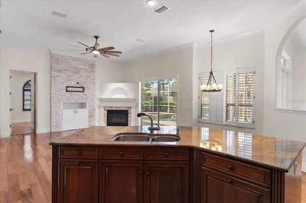 Fireplace, Interior, Kitchen, Pendant Lights, Recessed Lighting, Stone Walls, Wood Texture Flooring