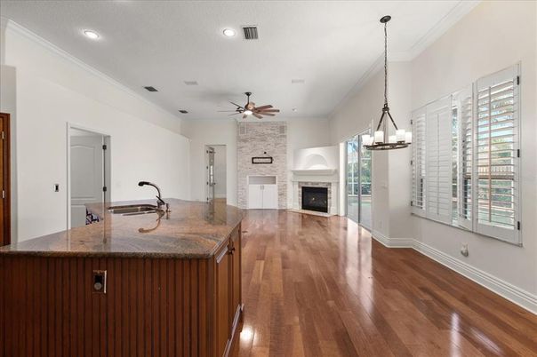Fireplace, Interior, Kitchen, Pendant Lights, Recessed Lighting, Stone Walls, Wood Texture Flooring