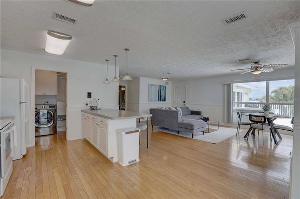 Dining room, Interior, Kitchen, Living room, Pendant Lights, Washer, Wood Texture Flooring