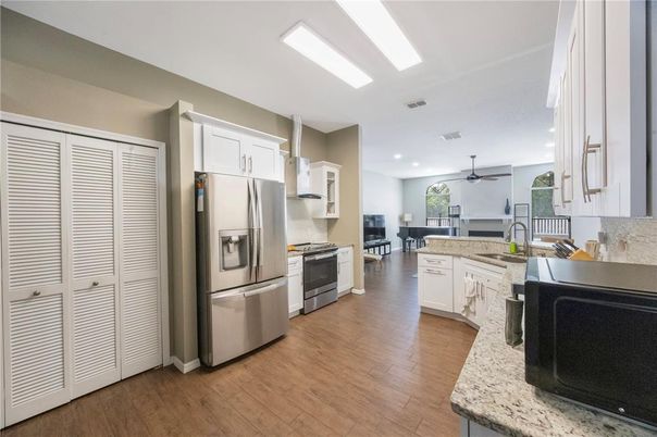 Interior, Kitchen, Recessed Lighting, Stainless Steel Appliances, Wood Texture Flooring