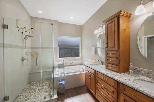 Bathroom, Dual Sink Vanities, Glass Shower, Interior, Recessed Lighting, Wood Texture Flooring