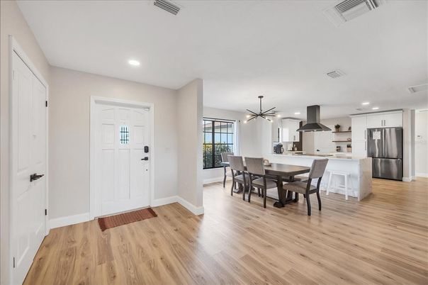 Dining room, Interior, Kitchen, Pendant Lights, Recessed Lighting, Stainless Steel Appliances, Wood Texture Flooring