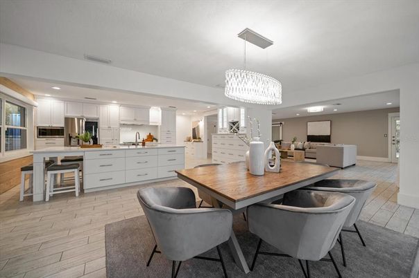 Chandelier, Dining room, Interior, Kitchen, Living room, Recessed Lighting, Stainless Steel Appliances, Wood Texture Flooring