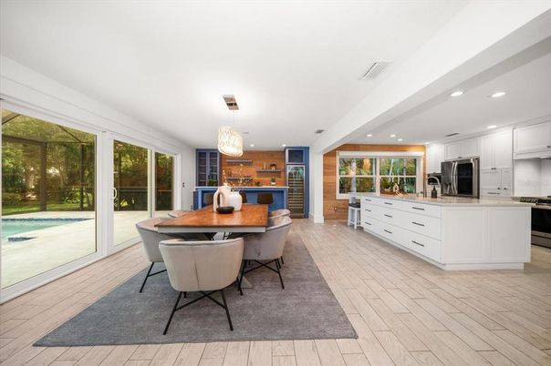 Dining room, Interior, Kitchen, Pendant Lights, Recessed Lighting, Stainless Steel Appliances, Wood Texture Flooring