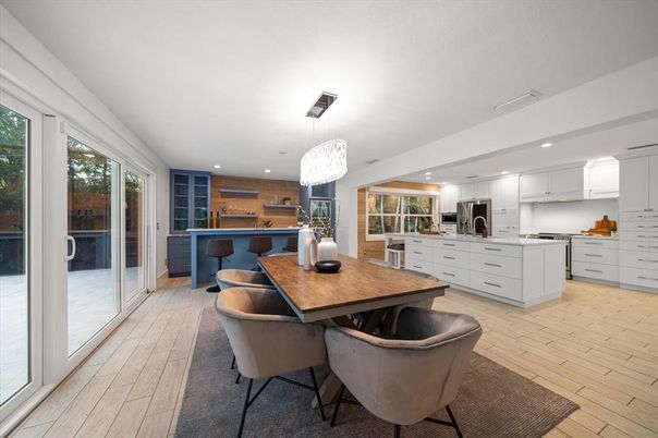 Chandelier, Dining room, Interior, Kitchen, Pendant Lights, Recessed Lighting, Stainless Steel Appliances, Wood Texture Flooring