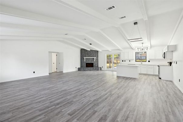 Empty room, Fireplace, Interior, Kitchen, Pendant Lights, Wood Texture Flooring