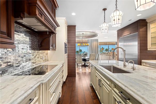 Dining room, Interior, Kitchen, Pendant Lights, Recessed Lighting, Stainless Steel Appliances, Wood Texture Flooring