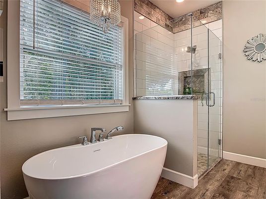 Bathroom, Chandelier, Free Standing Baths, Glass Shower, Interior, Recessed Lighting, Wood Texture Flooring
