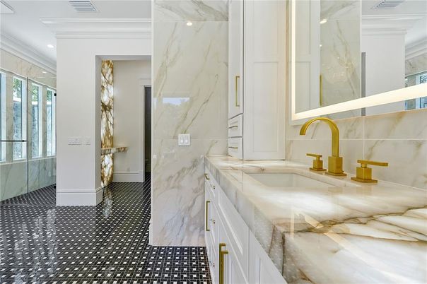 Bathroom, Chandelier, Dual Sink Vanities, Free Standing Baths, Interior, Marble Walls, Recessed Lighting