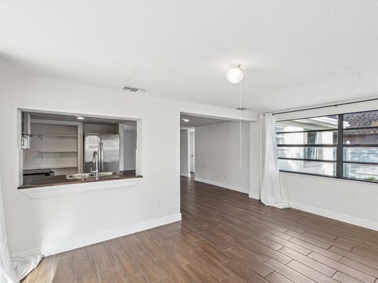 Empty room, Interior, Kitchen, Stainless Steel Appliances, Wood Texture Flooring