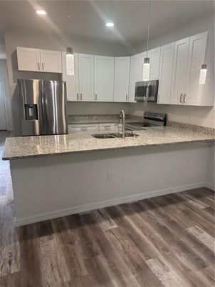 Interior, Kitchen, Pendant Lights, Recessed Lighting, Stainless Steel Appliances, Wood Texture Flooring