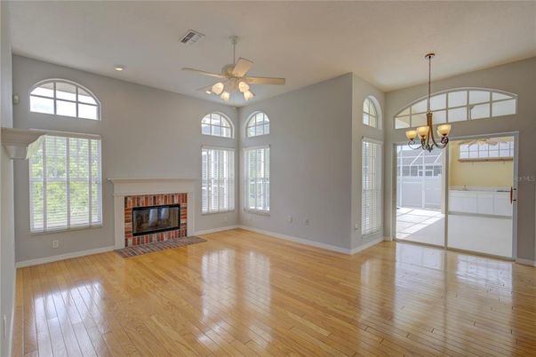 Chandelier, Empty room, Fireplace, Interior, Recessed Lighting, Wood Texture Flooring