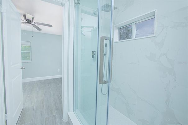Bathroom, Glass Shower, Interior, Marble Walls, Wood Texture Flooring